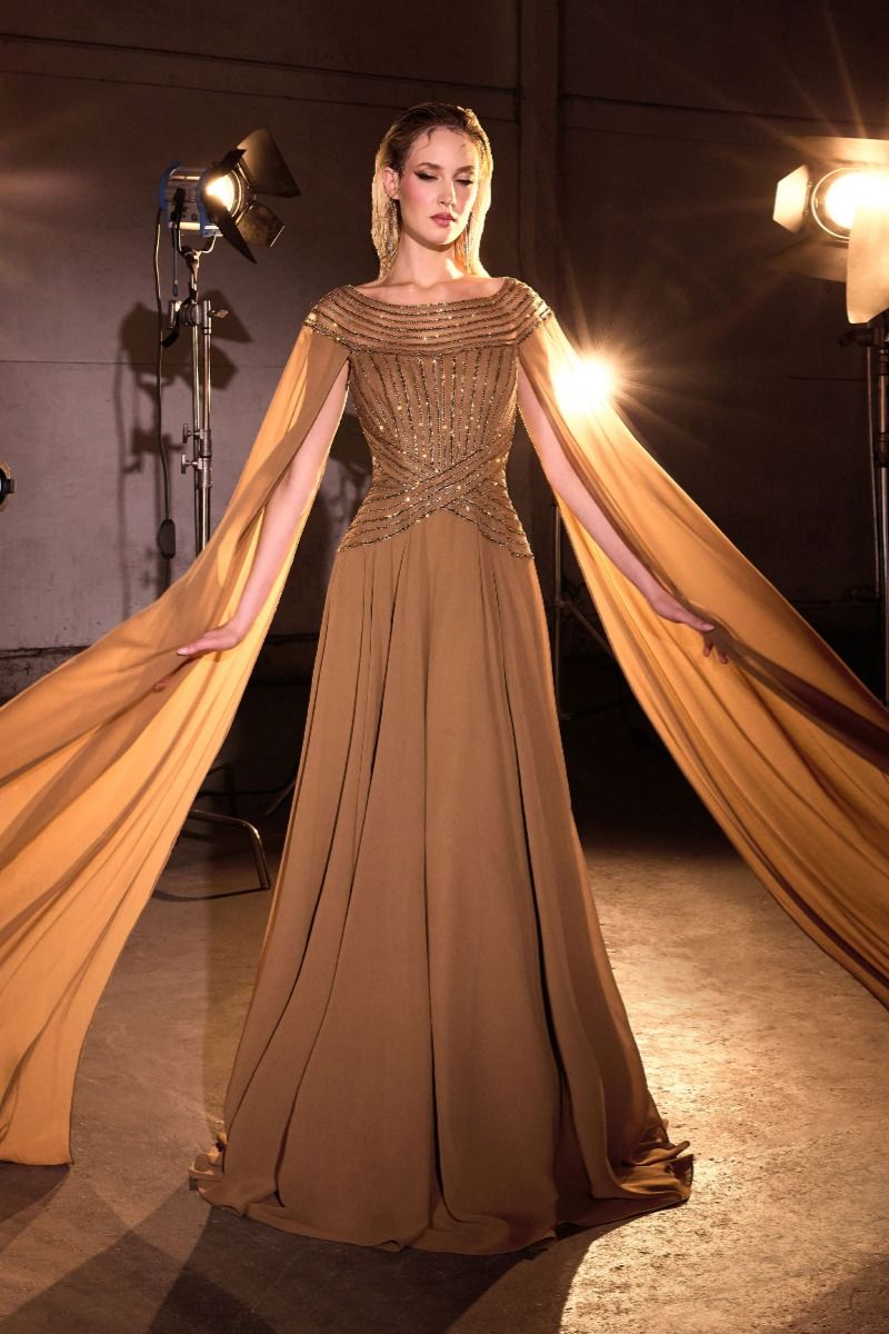 Bateau neckline w/ beaded bodice and dramatic cape sleeves